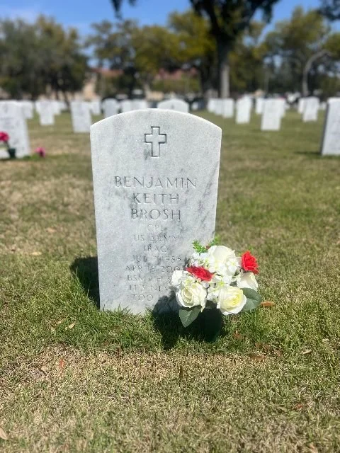 Real BloomBridge delivery confirmation photo — arrangement placed at the headstone of Benjamin Keith Brosh, US Army veteran