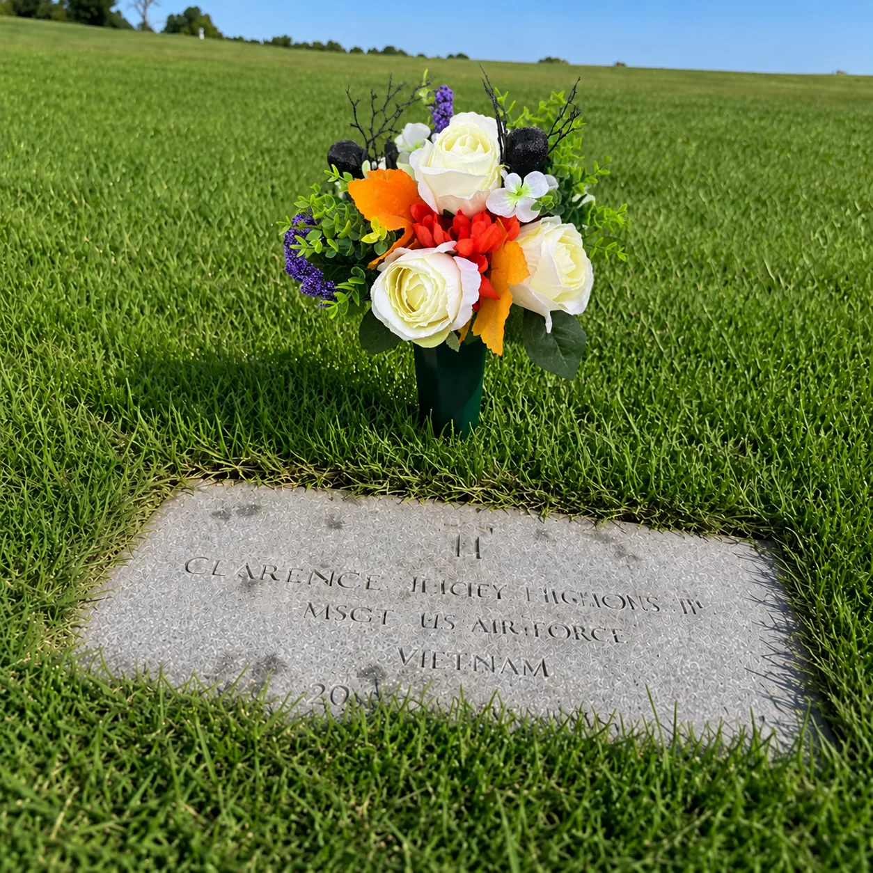 Halloween Arrangement beside a flat grave marker