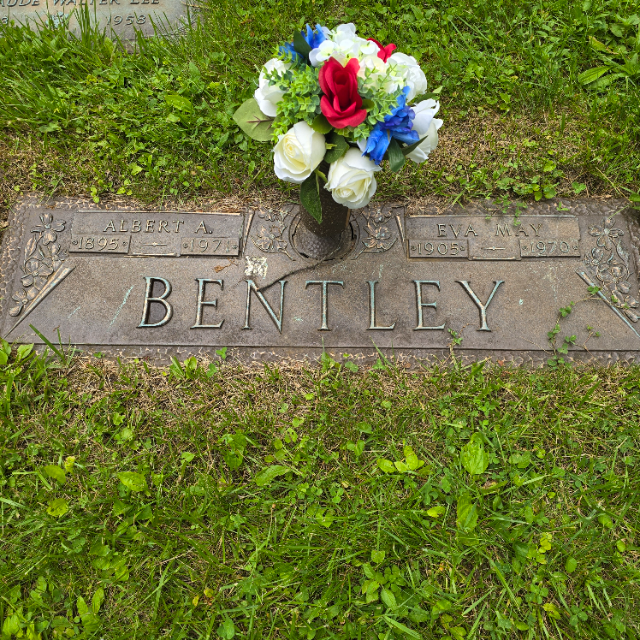 Patriotic arrangement at military marker