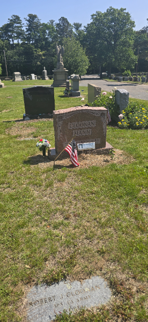 Red, White & Blue silk arrangement at a veterans cemetery headstone