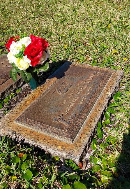 Red & White Roses arrangement at a grave