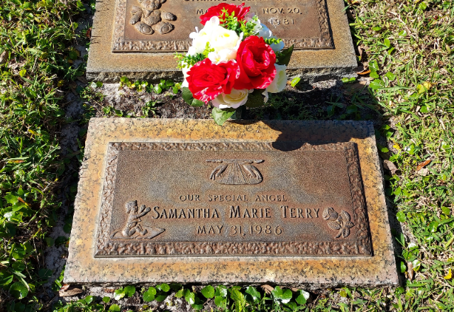 Red & White Roses arrangement at a grave