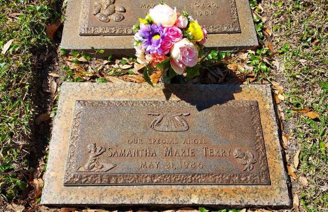 Red & White Roses arrangement at a grave