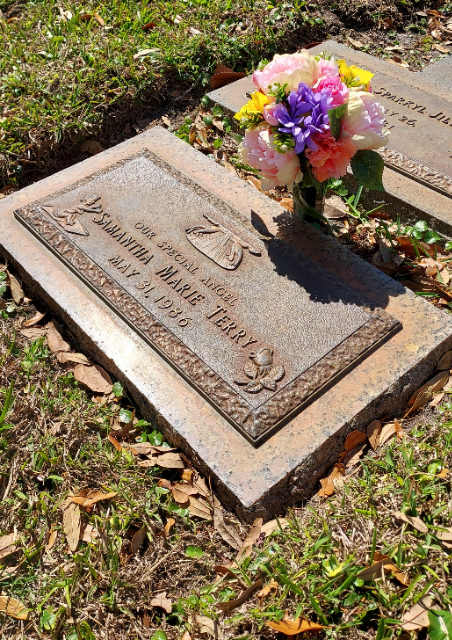 Red & White Roses arrangement at a grave