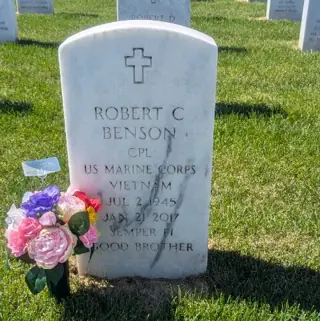 Flowers placed at a grave by a BloomBridge runner