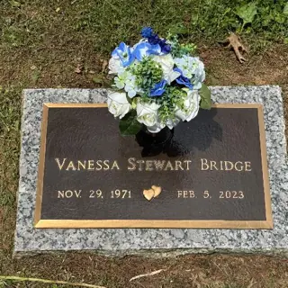 Flowers placed at a grave by a BloomBridge runner