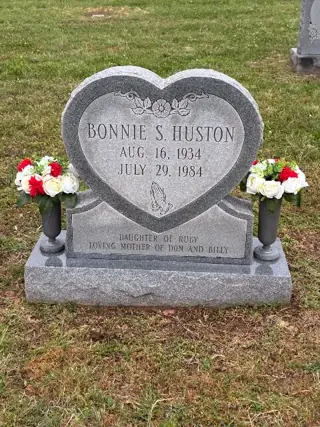 Flowers placed at a grave by a BloomBridge runner