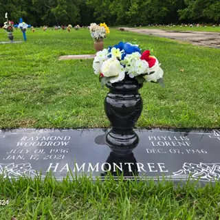 Flowers placed at a grave by a BloomBridge runner
