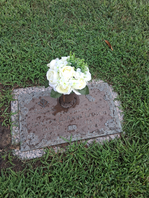 Flowers placed at the grave of LuAnne Ladson, Peninsula Memorial Park